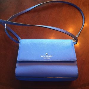 Blue cross body Kate spade purse.